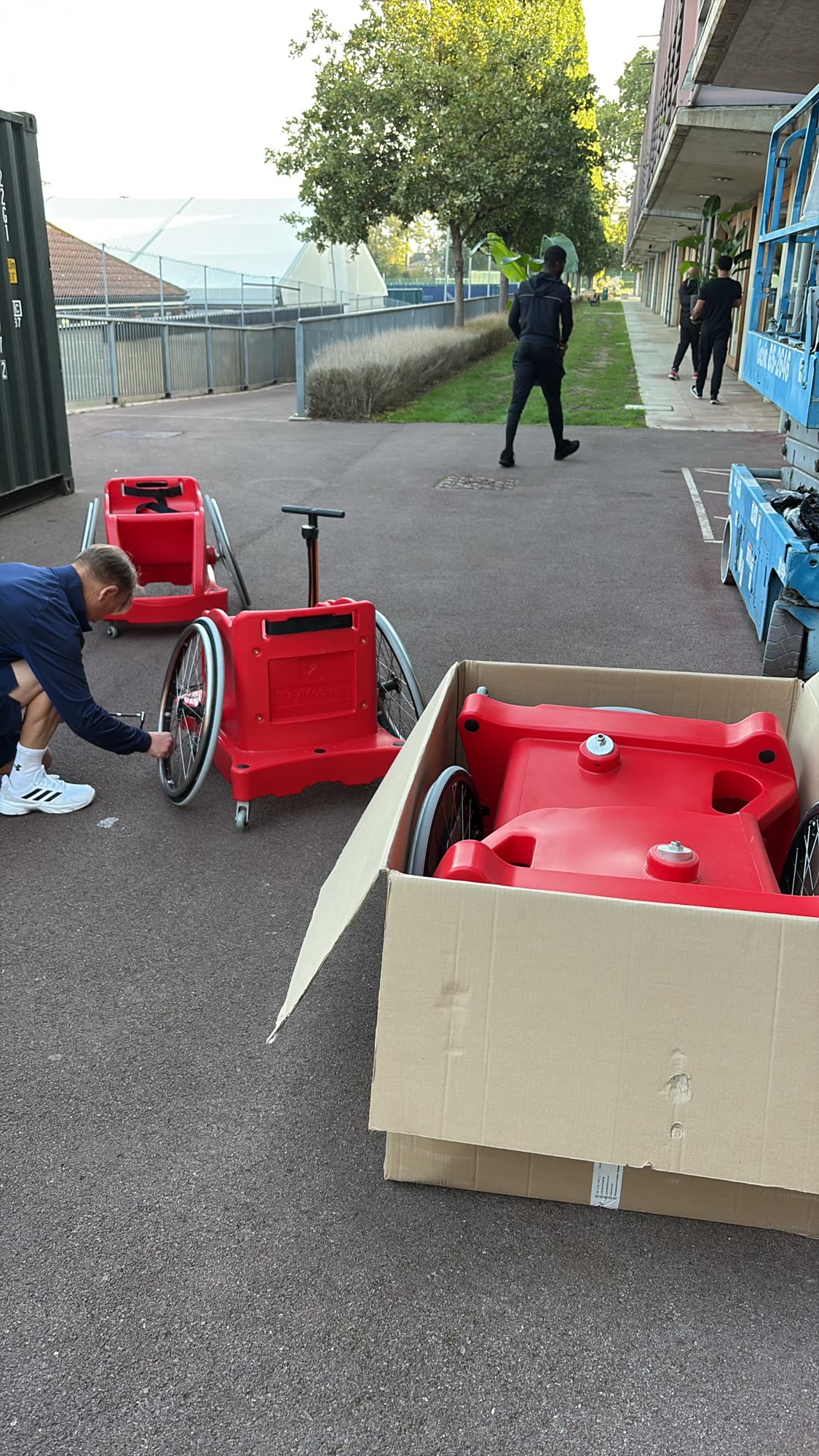 A sport wheelchair being unpacked from its delivery box